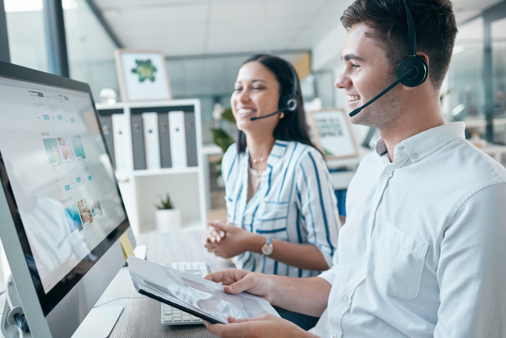 call-center-computer-team-with-document-customer-service-crm-telemarketing-office-man-woman-consultant-pc-while-happy-about-sales-contact-us-online-support-advice